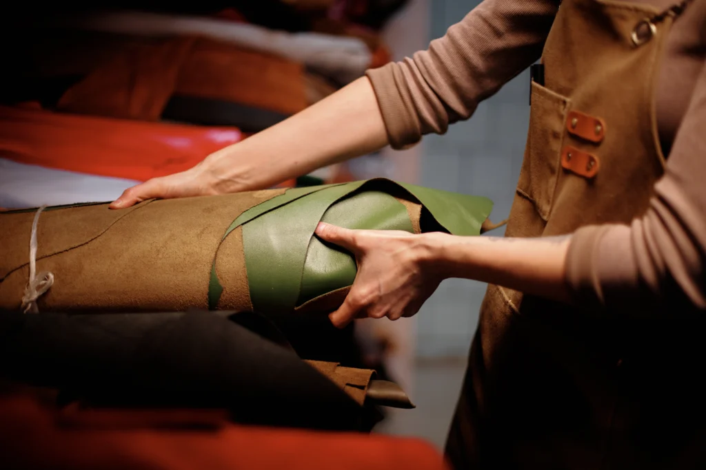 a woman is ready the product display on leather exhibition